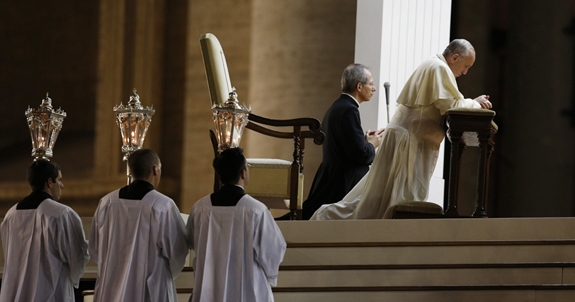 Pope Francis prays during a Sept. 7 vigil in St. Peter's Square