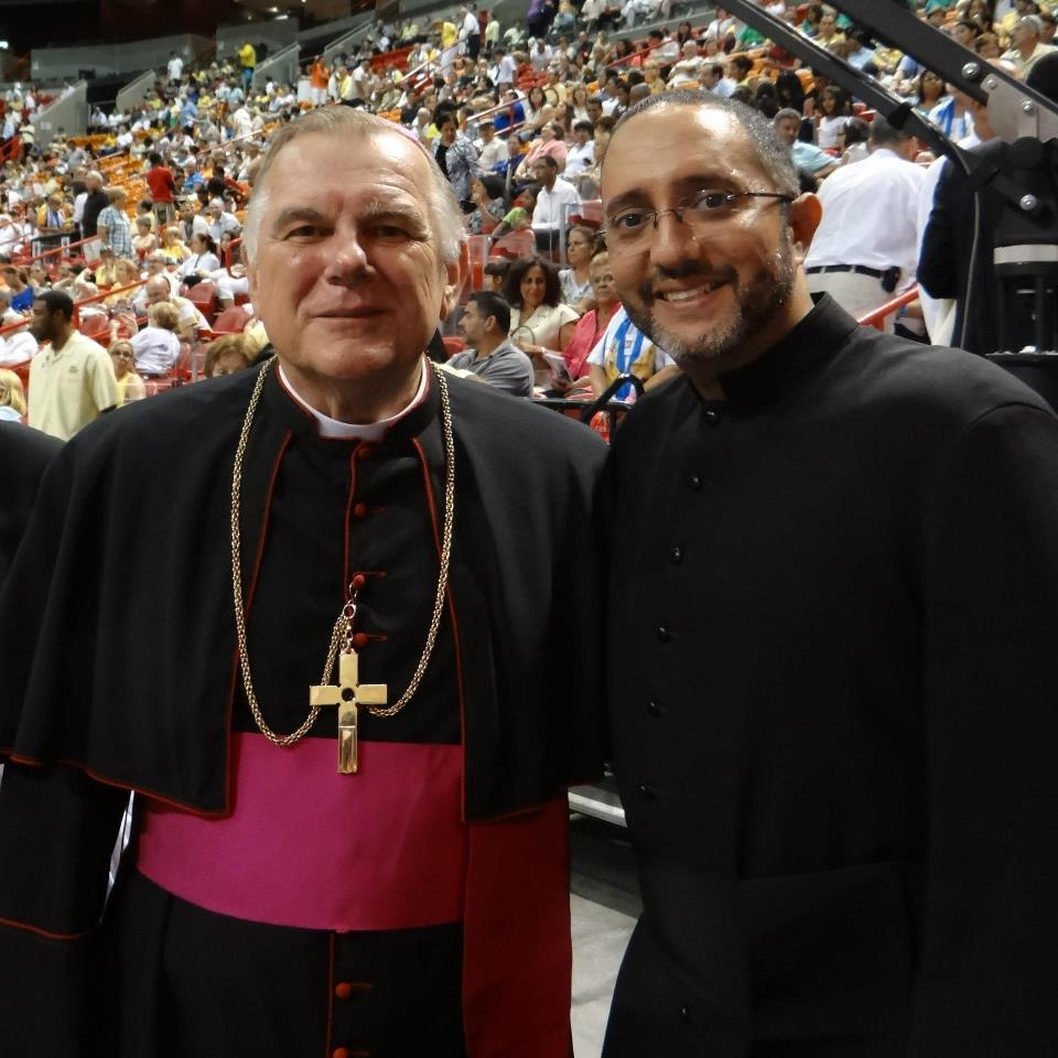 Seminarian Julio De Jesus poses with Miami Archbishop Thomas Wenski