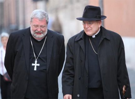 Bishop Daniel Jenky (left) strolls with Cardinal Raymond Burke