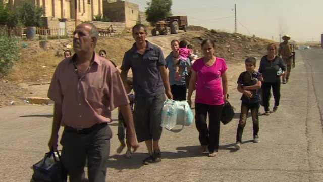 Christians flee Mosul earlier this summer